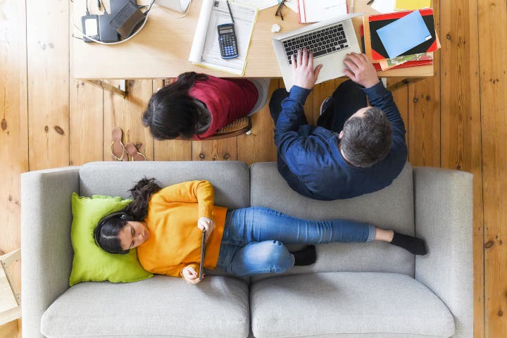 Overhead view of people learning at home